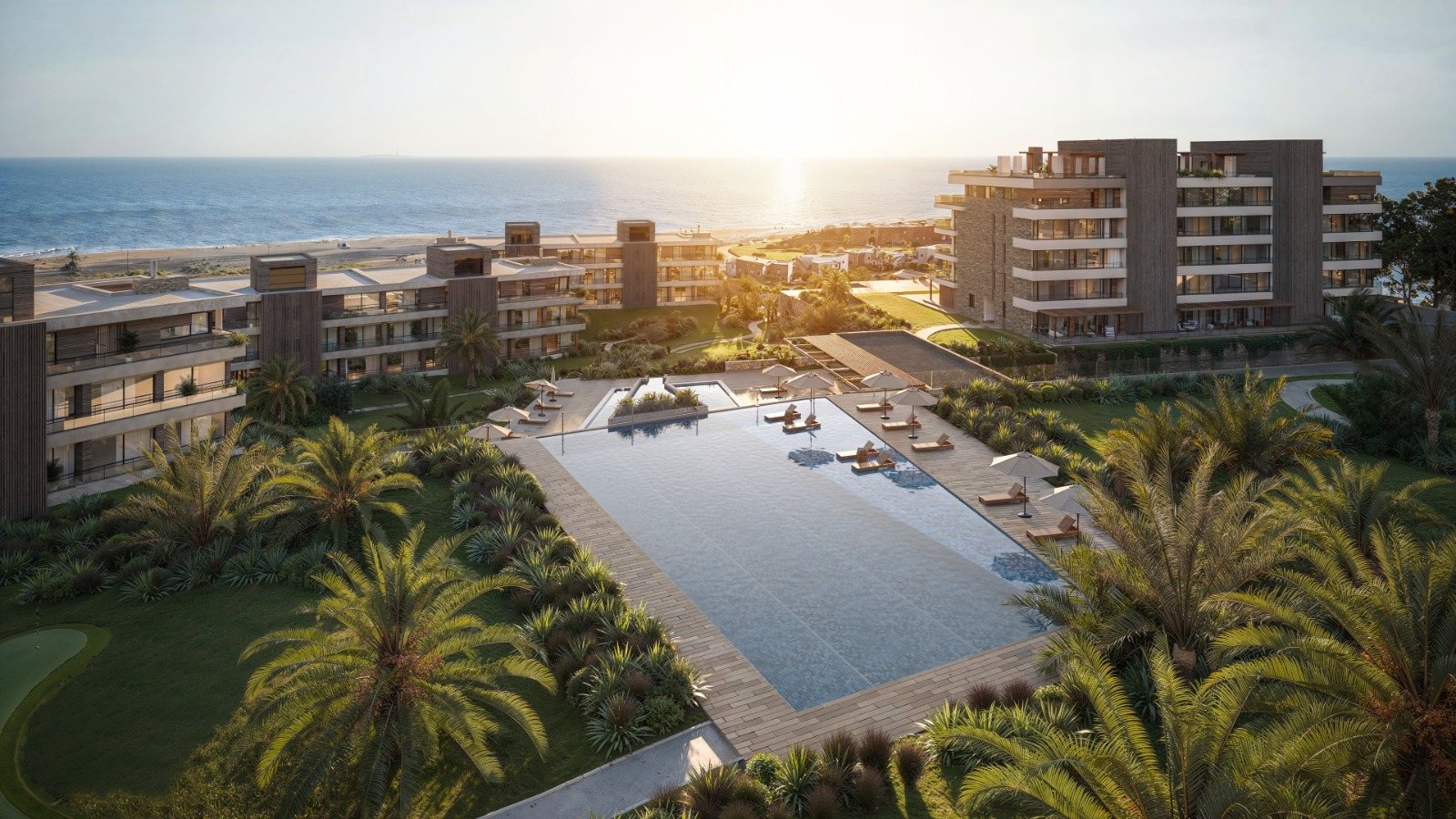 Selenza Residences — Piscina al atardecer con vista al mar