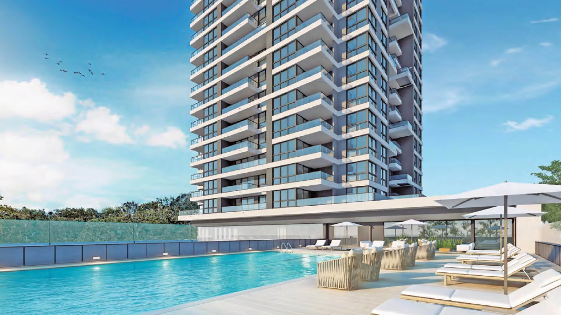 Render de la torre Atelier by Le Parc desde la piscina exterior, con reposeras y sombrillas