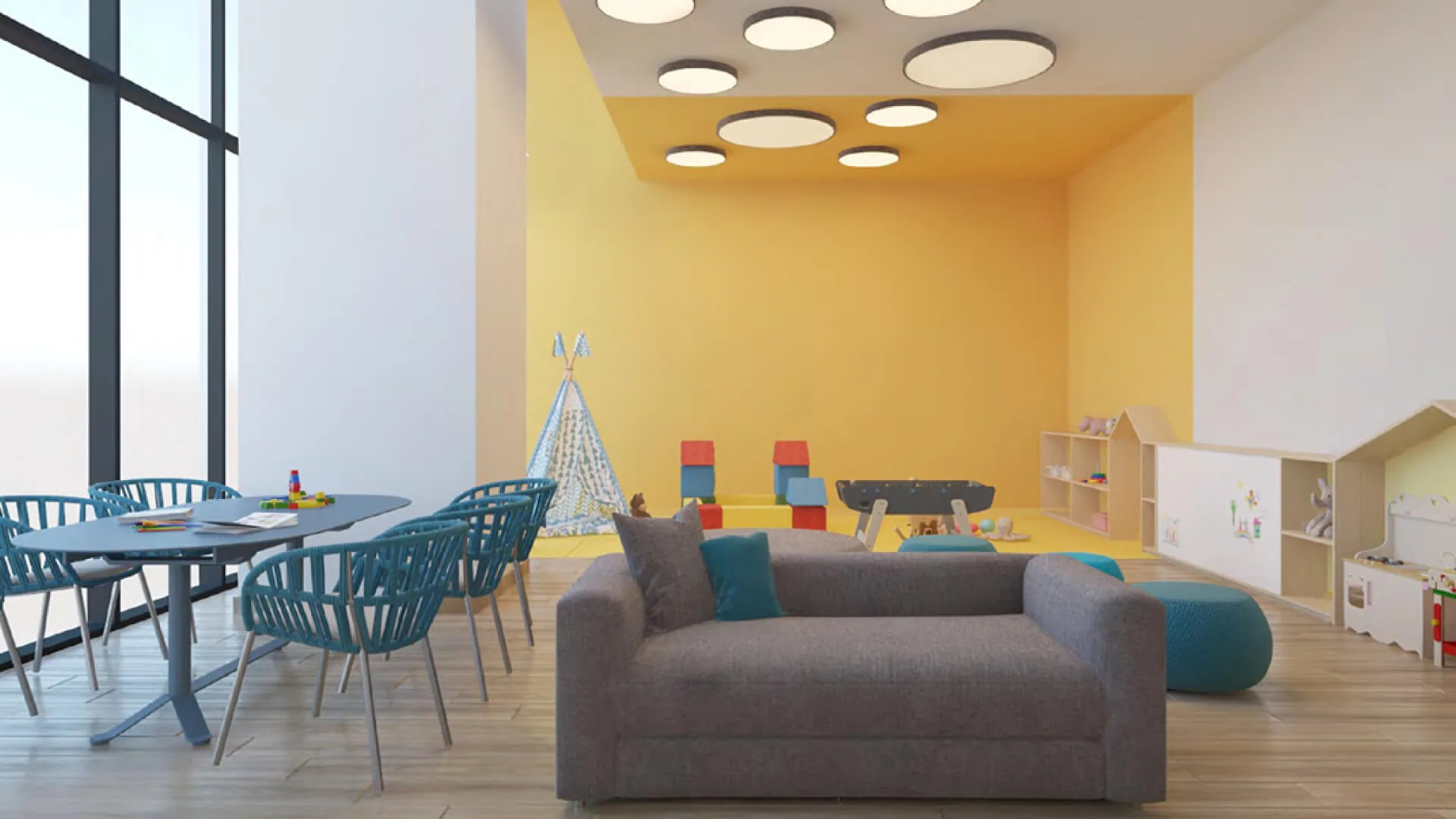 Render del espacio infantil con juegos y mesas