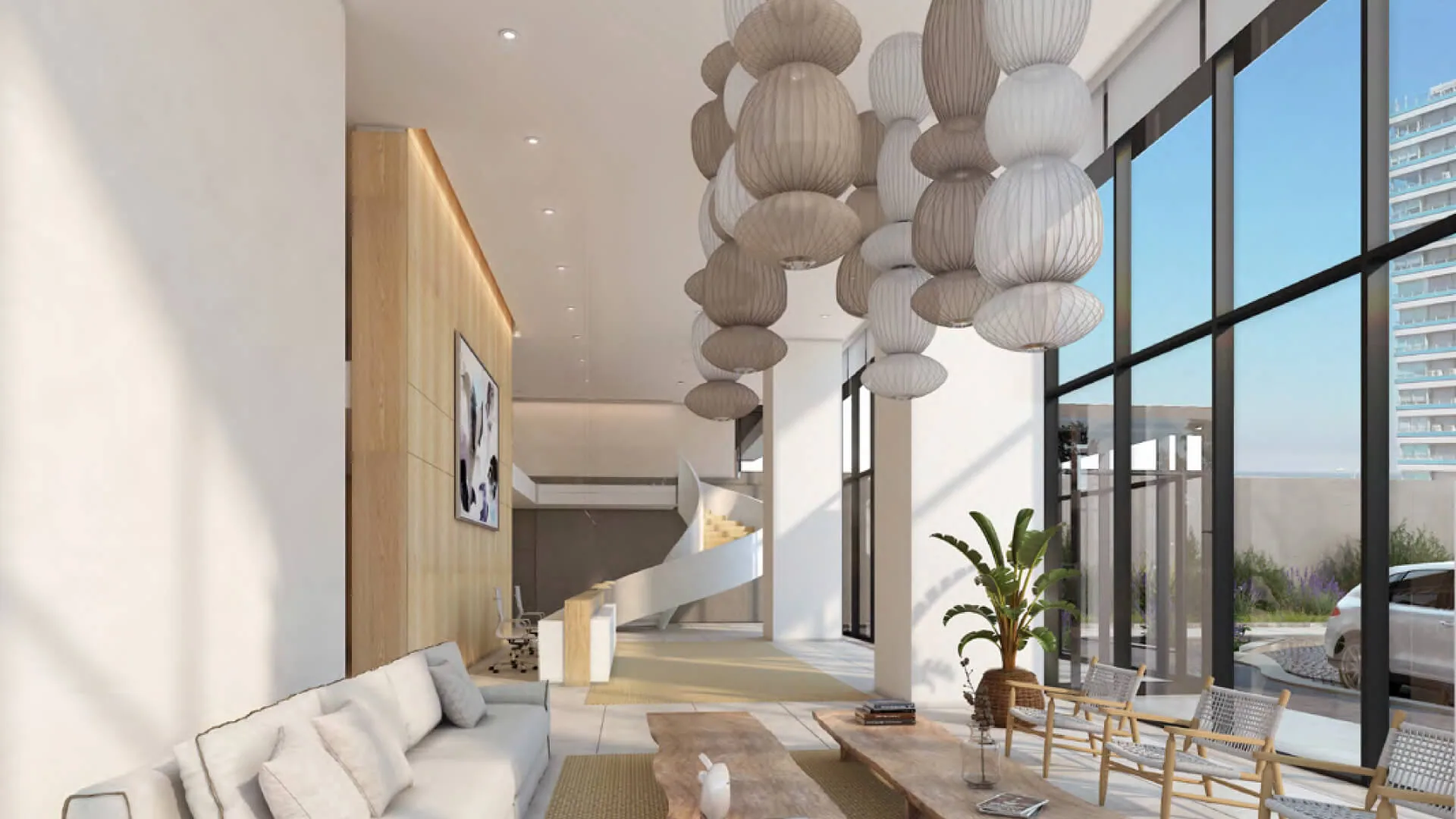 Render del lobby de doble altura con escalera escultórica y lámparas colgantes