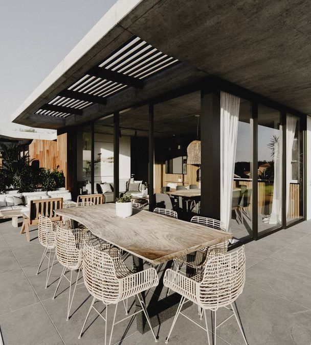 Render de la terraza con pérgola y comedor exterior