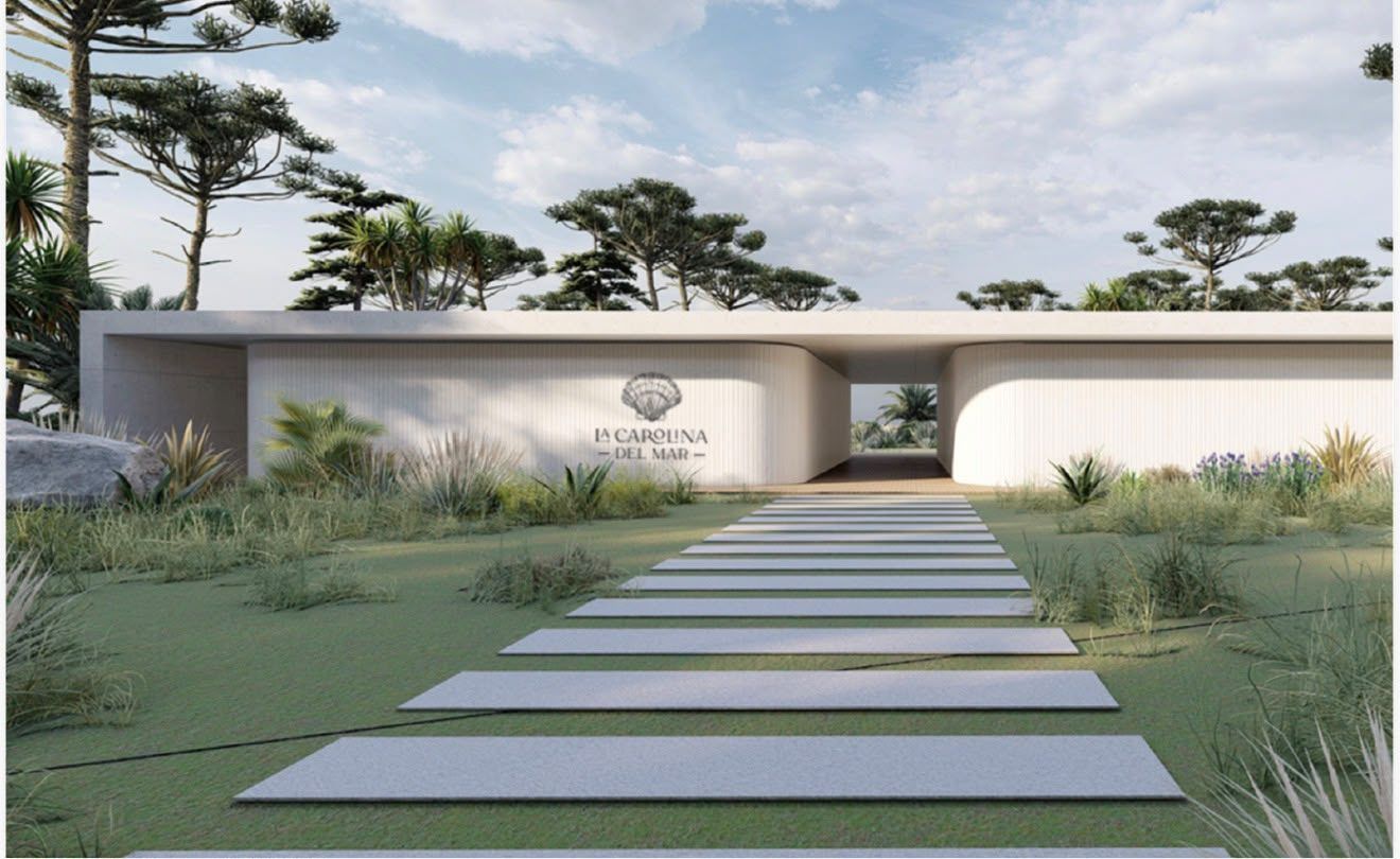 Render del acceso peatonal con el logo en el muro y la senda de losas