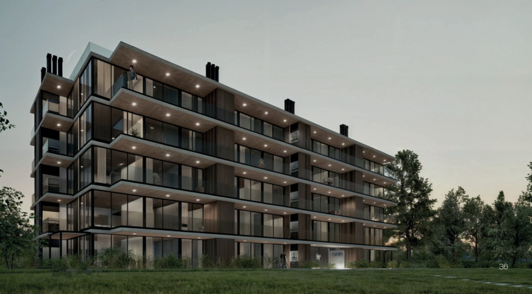 Render crepuscular del edificio Nirán de cinco pisos entre los árboles, en Punta Ballena