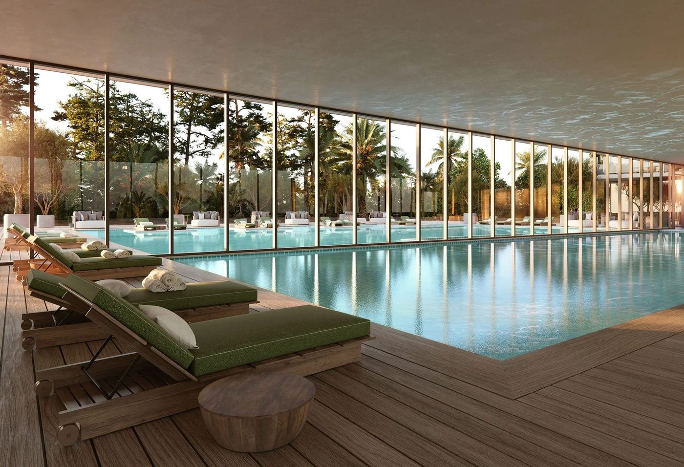 Render de la piscina interior con deck de madera y reposeras verdes