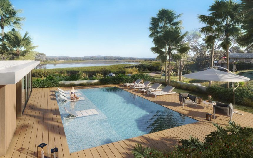Render de la piscina exterior con deck de madera, mirando a la laguna